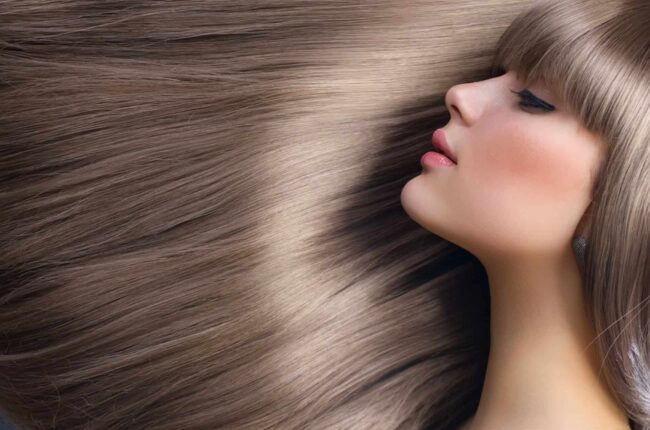 Woman with gorgeous, straight hair from Amaci Salon in Boston.
