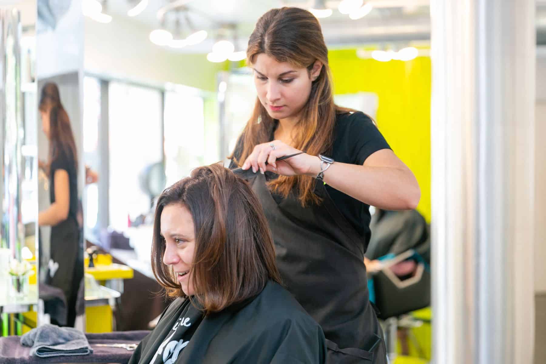 Boston Salon staff working on a client's hairdo
