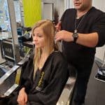 hairstylist trimming a woman's hair in amaci salon - before