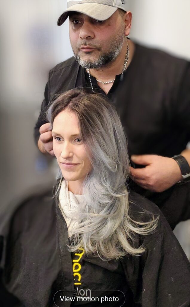 Smiley women with hairstylist